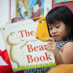 Picture of young child reading