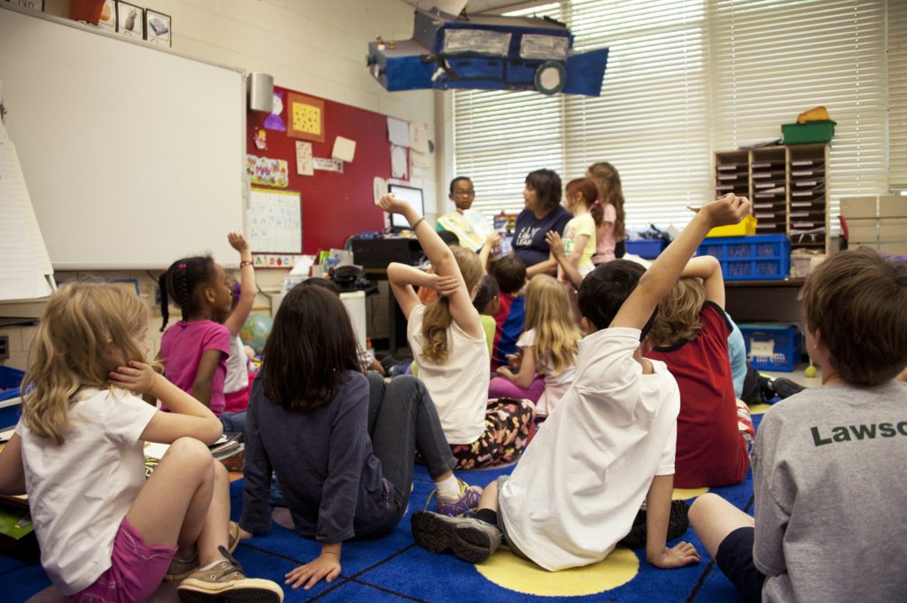 Picture of primary school children in classroom with teacher