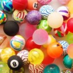 Picture of colourful soft balls. Some with numbers on.