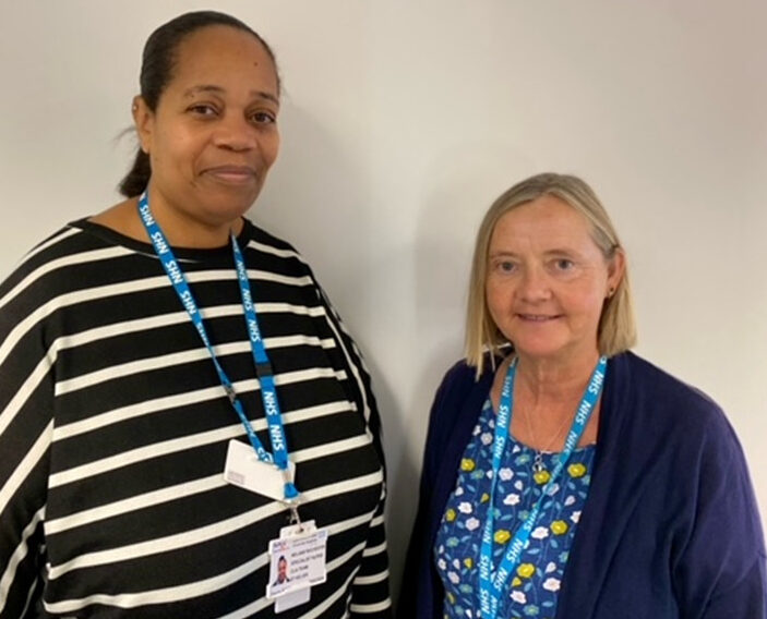 Two Children looked After Nurses looking to camera